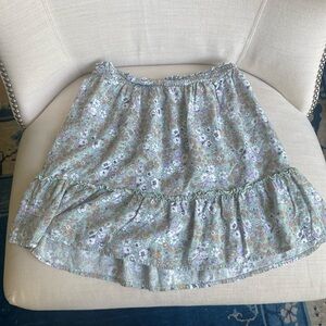 a green floral skirt